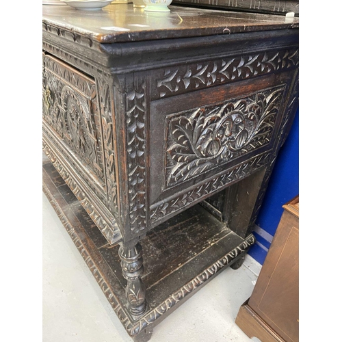 120 - 19th cent. Northern European sideboard/court cupboard with heavily carved front and back. 55ins. x 7... 