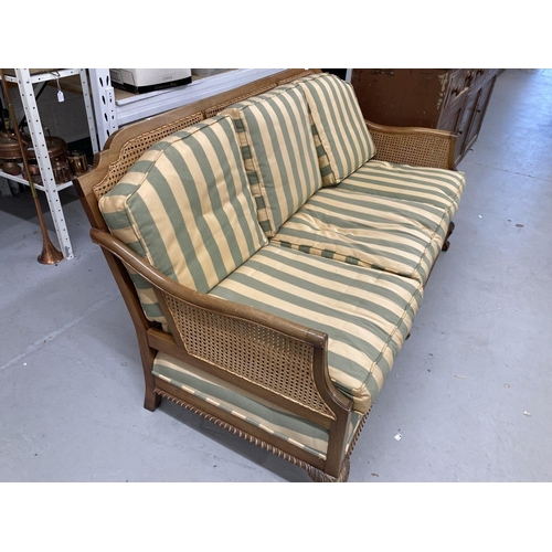 14 - 1930s style Bergere three seater sofa with striped upholstery. 69ins.