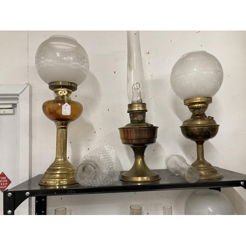 24 - Lighting: Oil lamps to include Duplex Aladdin Gem fire brass lamps, Hipolto lamp, T. Bowatt & Son co... 