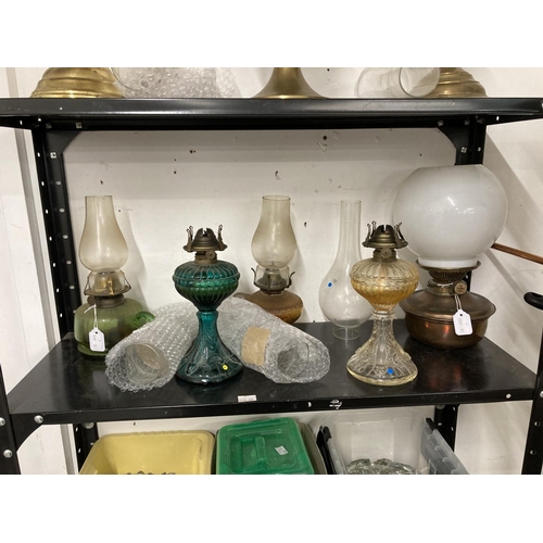 24 - Lighting: Oil lamps to include Duplex Aladdin Gem fire brass lamps, Hipolto lamp, T. Bowatt & Son co... 