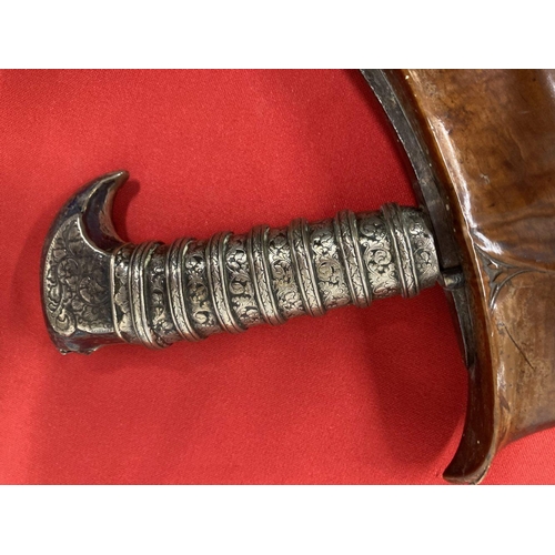 241 - Edged Weapons: 19th cent. Malay executioner's Kris, the silver cased handle with Niello work of scro... 