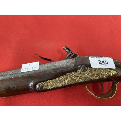 245 - 18th cent. Turkish flintlock with brass decorated lock plate and pommel. 20ins.