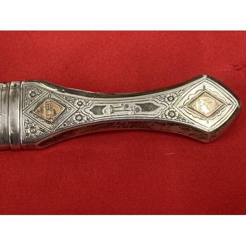 269 - Edged Weapons: White metal Jambiya dagger with yellow metal engraved diamond shaped panels to the ha... 