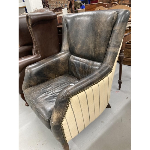 28 - Andrew Martin Harrow style leather and fabric high back armchair.