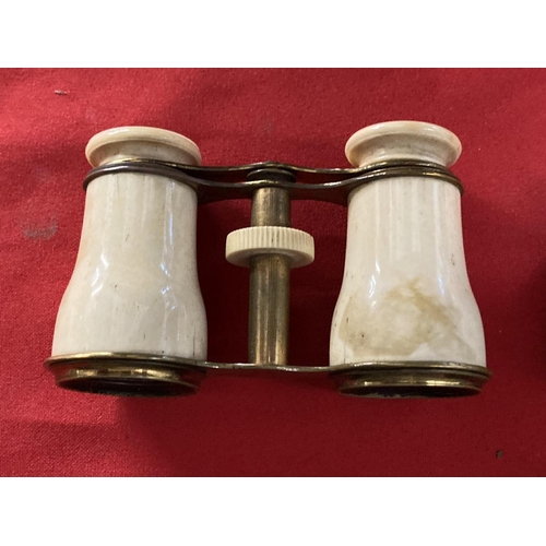 356 - Early 20th cent. Opera glasses decorated with mother of pearl, plus one other pair, both in fitted c... 