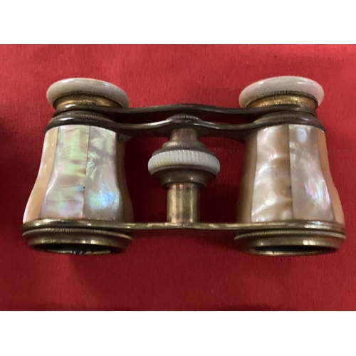 356 - Early 20th cent. Opera glasses decorated with mother of pearl, plus one other pair, both in fitted c... 