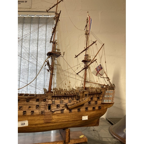 368 - H.M.S. Victory: Treen model on stand 34ins. In need of restoration. Plus a framed portrait of Her Ma... 