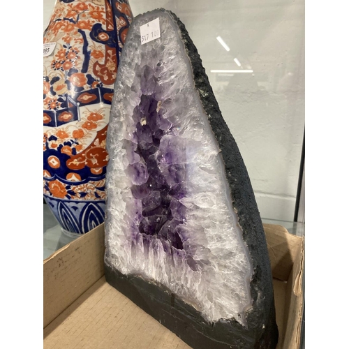 393 - Mineral Specimens: Large amethyst half. Core width 8½ins. Height 12ins. Plus small spray of malachit... 