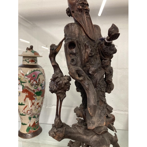 399 - 19th cent. Qing Dynasty carved rootwood figure of Shoulao shown standing holding a staff and a peach... 