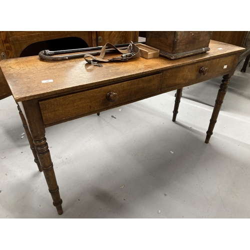 40 - 19th cent. Mahogany two drawer side table on turned ring legs. 48ins. x 16ins. x 27¾ins.