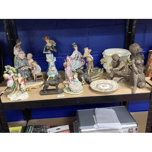 409 - Continental Porcelain: Various figures to include a mother and children, young couples, a golfer, an... 