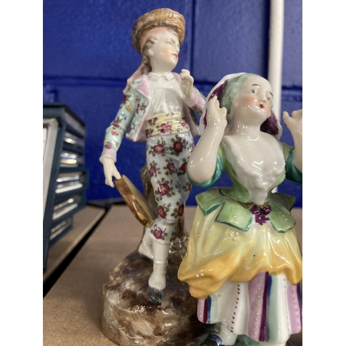 418 - Schierholz Figurines: Young girl and boy decorated in coloured enamels, he's holding a tambourine an... 