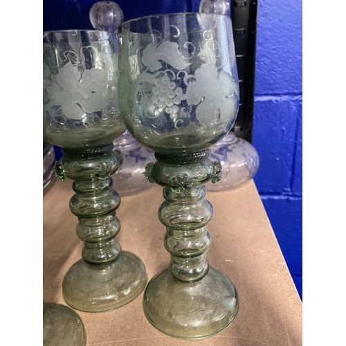 465 - Late 19th cent. Green etched glass wine goblets with applied punts, probably German. 7½ins. (4)