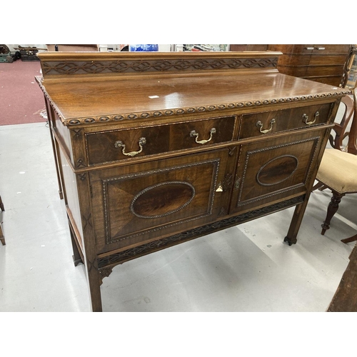 51 - 1920s mahogany sideboard two drawers above two cupboards decorated in the Jacobean style with applie... 