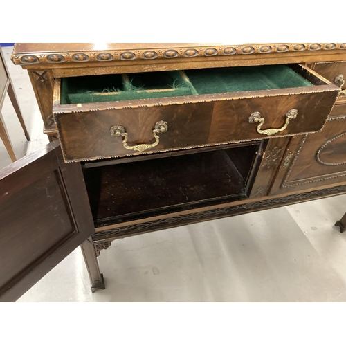 51 - 1920s mahogany sideboard two drawers above two cupboards decorated in the Jacobean style with applie... 