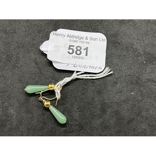 581 - Jewellery: Yellow metal drop earrings each set with a pear shaped jade. Test as 18ct gold. Weight 1.... 