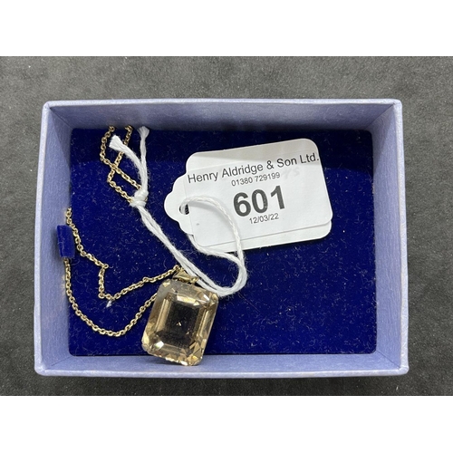 601 - Jewellery: Yellow metal necklet with a rectangular citrine pendant attached, tests as 9ct gold. Leng... 