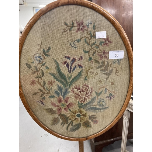 68 - 19th cent. Mahogany pole screen the oval embroidered panel in a glazed and moulded surround on a tur... 