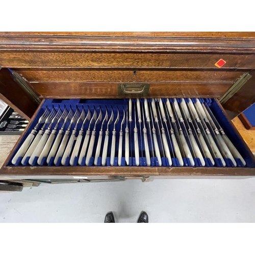 8 - 19th cent. Mahogany Wellington canteen of cutlery, the lift up lid and five drawers containing a lar... 