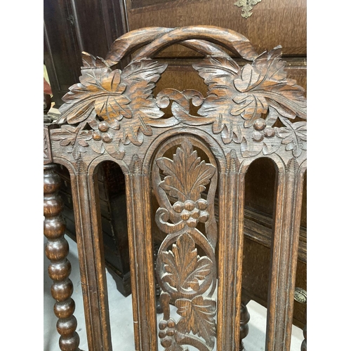 86 - 19th cent. Oak Carolean style elbow chair, carved back and seat, barley twist and carved supports.