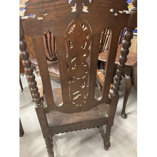 86 - 19th cent. Oak Carolean style elbow chair, carved back and seat, barley twist and carved supports.