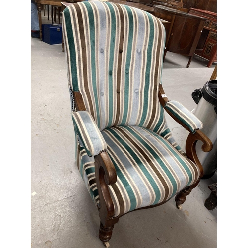 97 - 19th cent. Button back library armchair with scroll arms and turned legs on castors. 40ins. High. 27... 