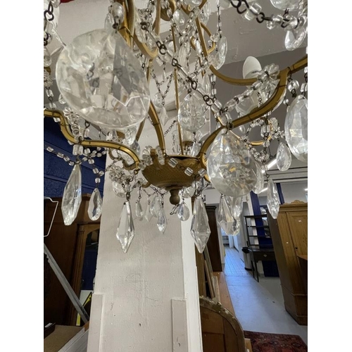 10 - 20th cent. Gilt chandeliers, the largest with six shaped branches, glass sconces and drops, 24ins dr... 