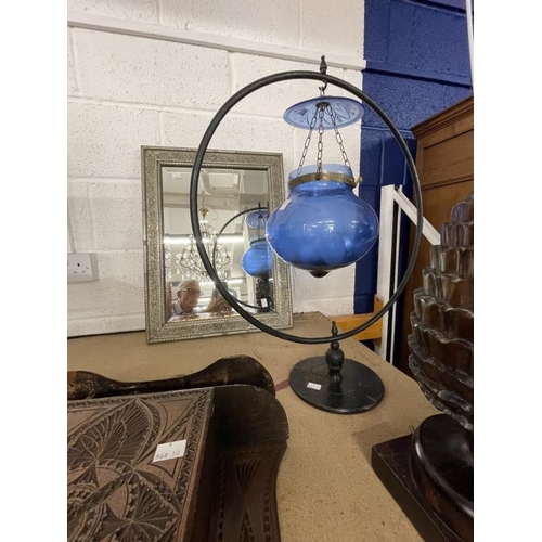 11 - 20th cent. Pineapple lamp, blue glass in a hoop lamp, hanging wall cabinet and a silvered mirror.