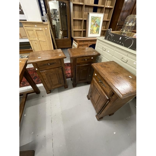 32 - 20th cent. Oak bedside cupboards, a pair with single drawer above a cupboard door on square block fe... 