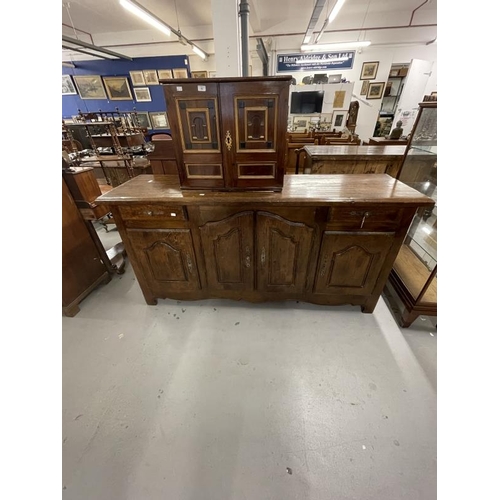 60 - 20th cent. Country style oak sideboard with two drawers over two side cupboards, the large central c... 