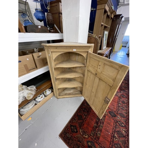 9 - Late 19th/early 20th cent. Pine corner cupboard, single door and applied mouldings. 31ins. x 13ins. ... 