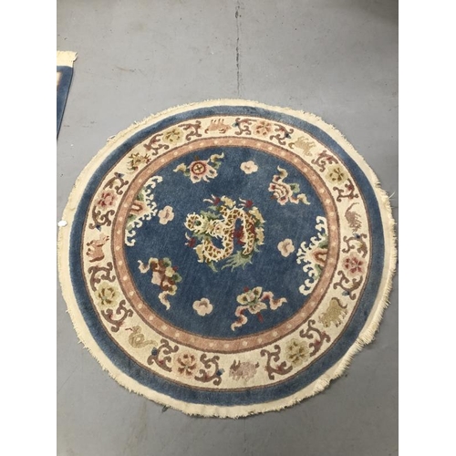 10 - Carpets & Rugs: Chinese hand washed circular rug, blue ground with a central panel depicting dragon ... 
