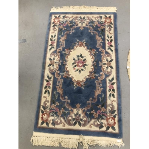 10 - Carpets & Rugs: Chinese hand washed circular rug, blue ground with a central panel depicting dragon ... 