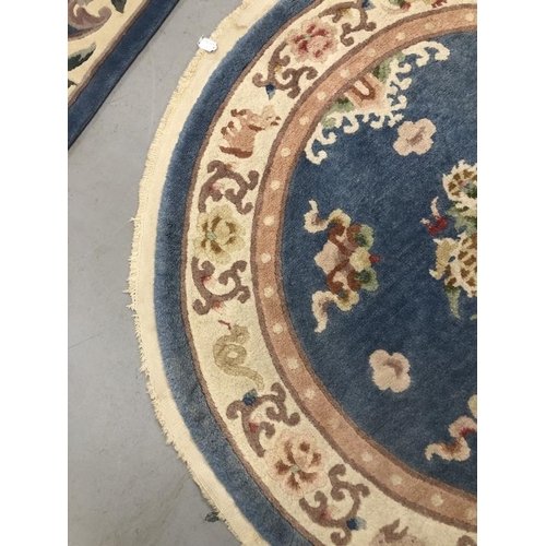 10 - Carpets & Rugs: Chinese hand washed circular rug, blue ground with a central panel depicting dragon ... 