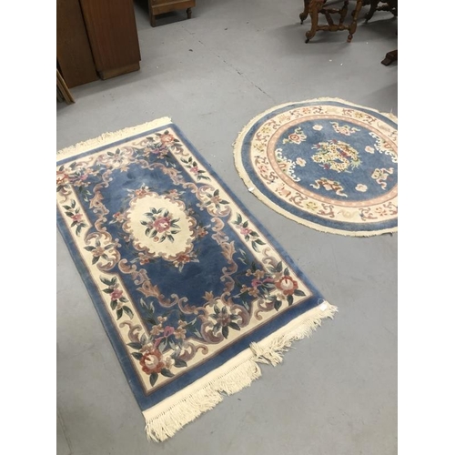 10 - Carpets & Rugs: Chinese hand washed circular rug, blue ground with a central panel depicting dragon ... 