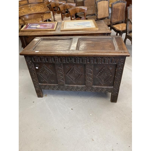 121 - 18th cent. Carved oak coffer with sunken two panel lid, original hinges, a three panel front with de... 