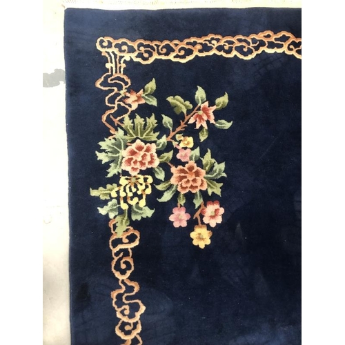 14 - Carpets & Rugs: Chinese hand wash blue ground, floral decoration in reds, greens, ivories and browns... 