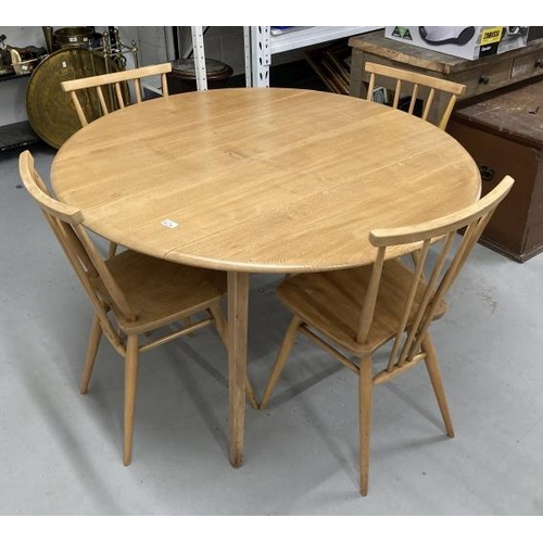 20A - Mid 20th cent. Ercol ash oval drop leaf table and four model 391 stick back chairs with sticks exten... 