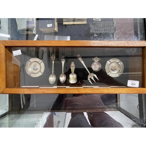 264 - Royal Navy/Militaria: A collection of enamel ships spoons and ashtrays most notably HMS Hood pickle ... 