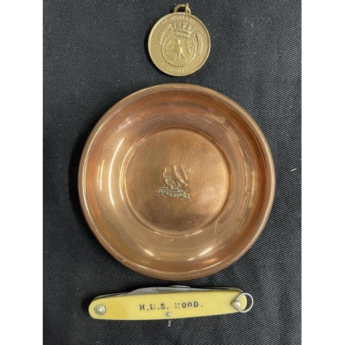 279 - Militaria/Royal Navy: H.M.S. Hood copper ashtray, penknife, Hood Whalers Club medal. (3)