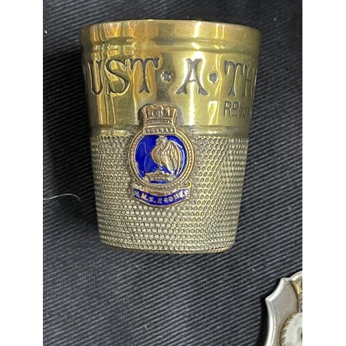 280 - Militaria/Royal Navy: H.M.S. Rodney rum measure, copper ashtray, caddy spoon and oval dish.