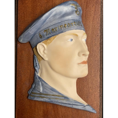 288 - Militaria: Unusual ceramic Kriegsmarine plaque depicting a sailor mounted on board. 6½ins. Plus a ca... 