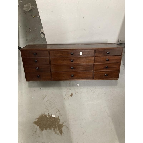 38 - 19th cent. Mahogany bank of twelve drawers, polished top with reeded edge, the central four drawers ... 