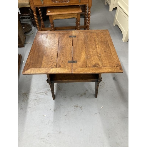 45 - Oak arts and crafts revolving table in style of Heals. 21ins. x 14ins. x 22ins.