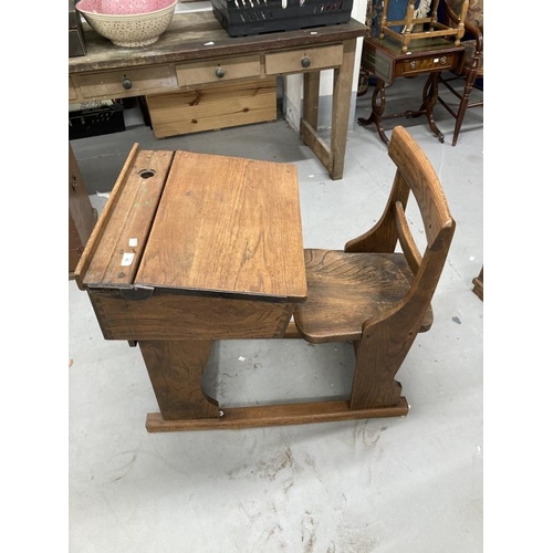 46 - Pre-war oak and elm adjustable flip top child's school desk and bar back chair.