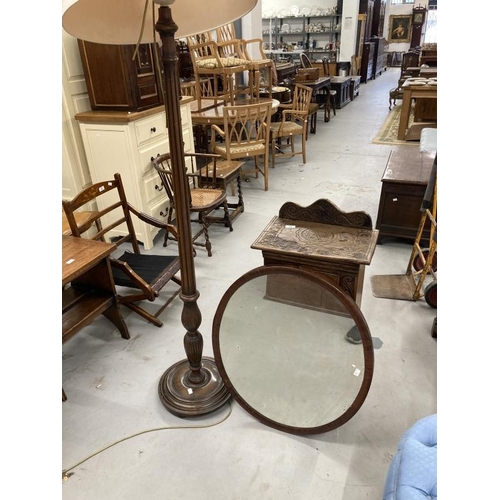 47 - 20th cent. Carved oak pot cupboard, mahogany standard lamp and oval mirror.