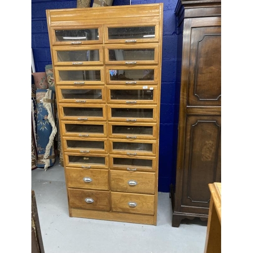 5 - Post-war haberdasher's shop display with sixteen glazed drawers above four others, all with chrome h... 