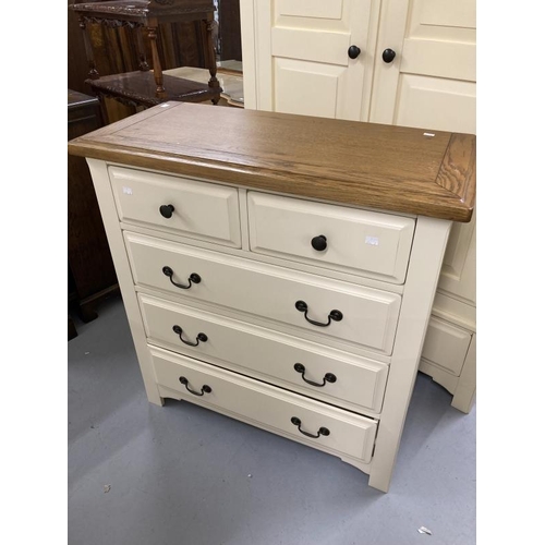 55 - 20th cent. Two door wardrobe with moulded oak cornice above two cream painted doors above a single d... 