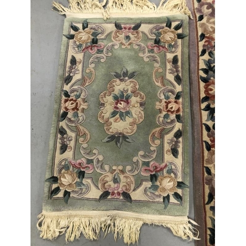6 - Carpets & Rugs: Chinese hand washed runner, mauve ground, floral decoration in reds, blues, greens a... 