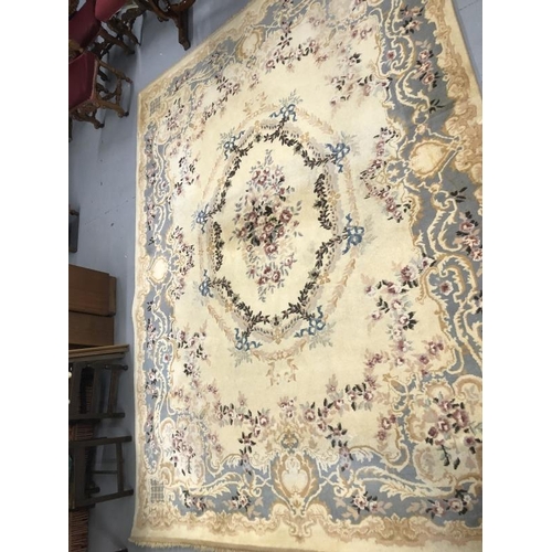 8 - Carpets & Rugs: British made carpet, cream ground with floral decoration, ribbon and garland decorat... 